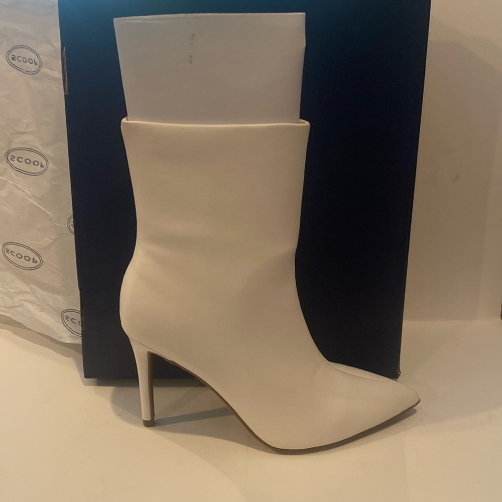 NWT women’s white size 8 mid calf stiletto heels.